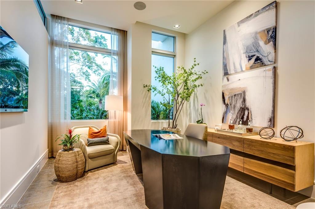 2175 Crayton Road Naples, FL 34103 - Photo 20 of 34 a living room with furniture and a potted plant