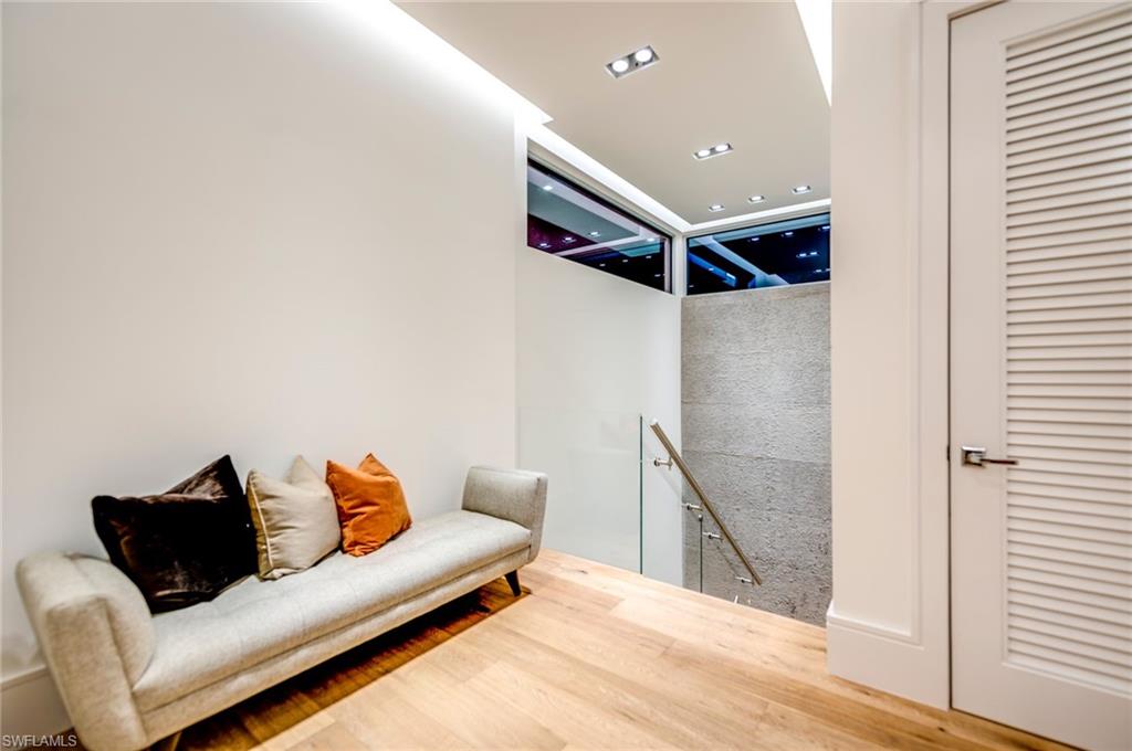 2175 Crayton Road Naples, FL 34103 - Photo 23 of 34 a living room with furniture and a ceiling fan