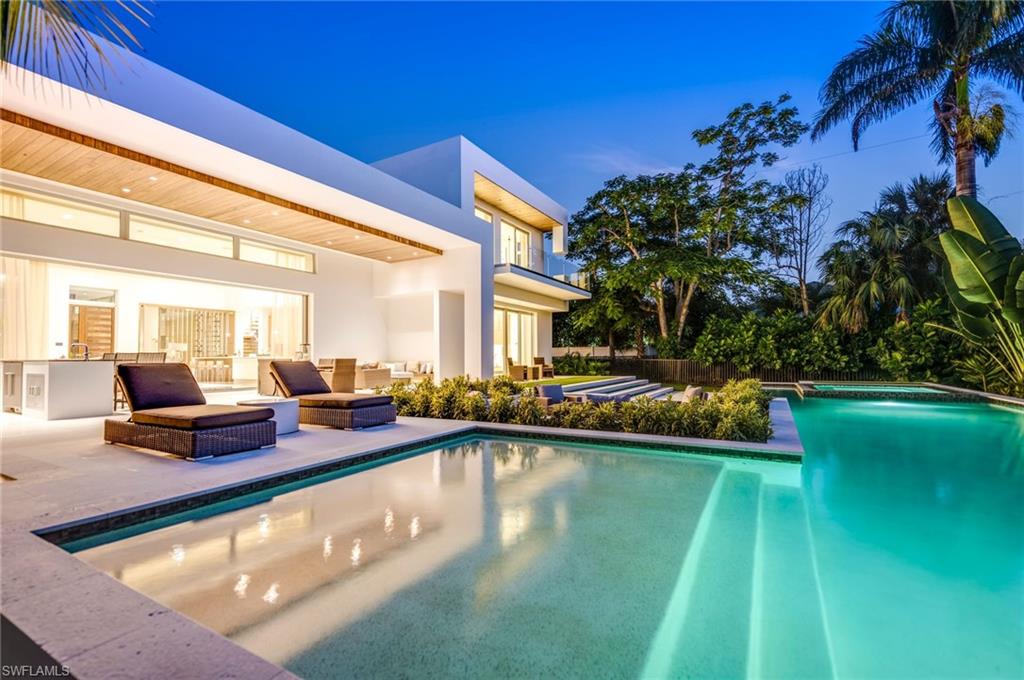 2175 Crayton Road Naples, FL 34103 - Photo 3 of 34 a view of swimming pool with chairs