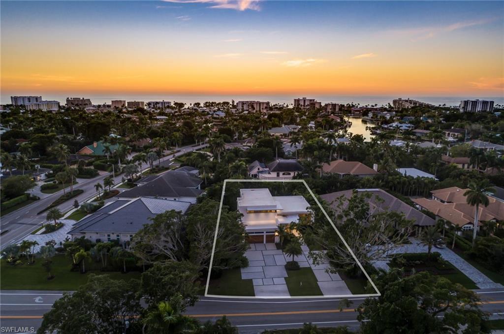 2175 Crayton Road Naples, FL 34103 - Photo 33 of 34 an aerial view of residential houses with outdoor space