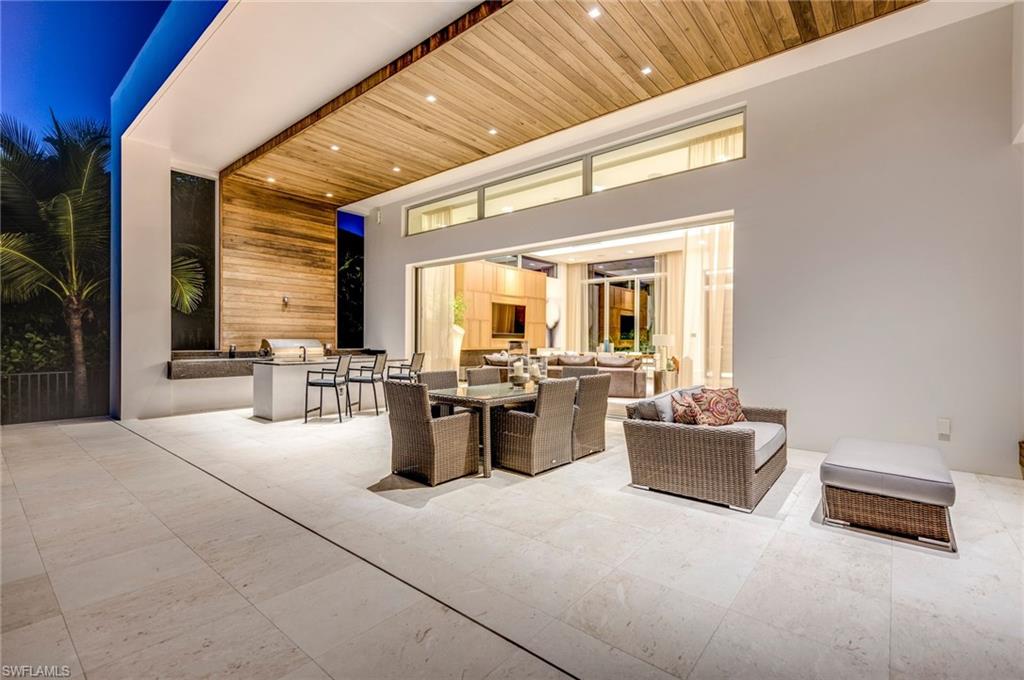 2175 Crayton Road Naples, FL 34103 - Photo 5 of 34 a lobby with furniture and window