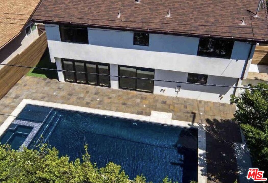 5515 Ruthwood Drive Calabasas, CA 91302 - Photo 2 of 48 a balcony with table and chairs