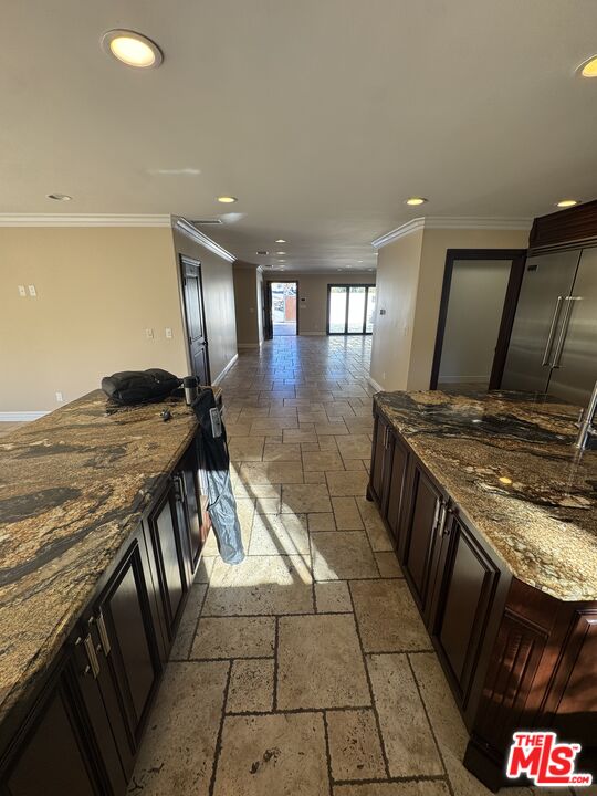 5515 Ruthwood Drive Calabasas, CA 91302 - Photo 21 of 48 a kitchen with granite countertop a stove a sink and a table