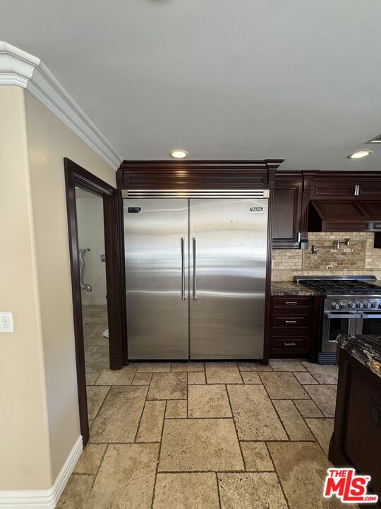 5515 Ruthwood Drive Calabasas, CA 91302 - Photo 24 of 48 a kitchen with granite countertop a refrigerator and a stove top oven