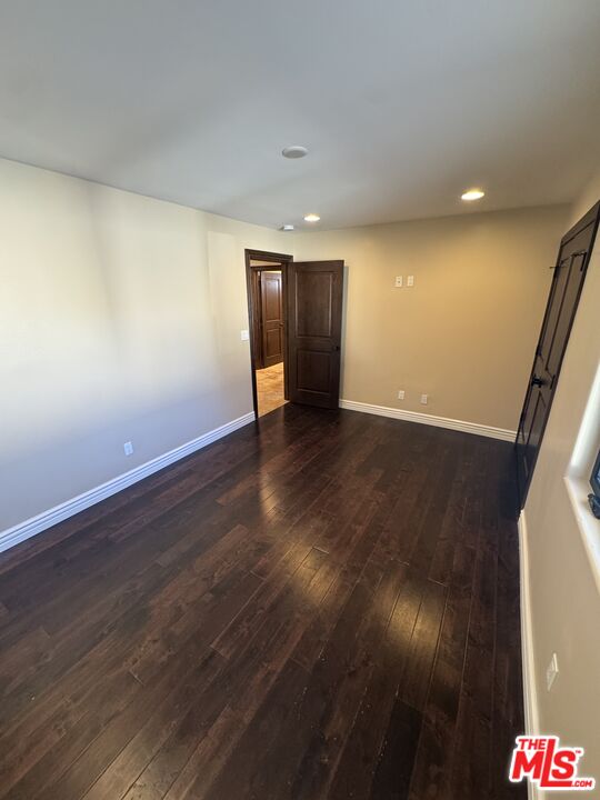 5515 Ruthwood Drive Calabasas, CA 91302 - Photo 25 of 48 a view of an empty room and wooden floor