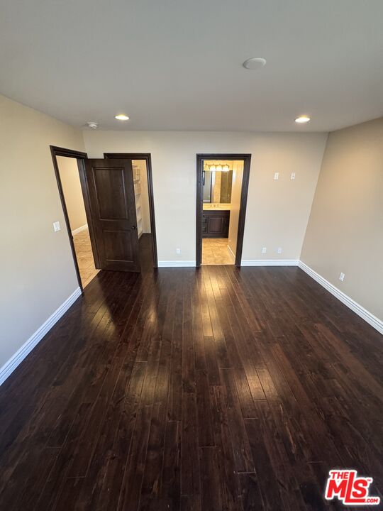 5515 Ruthwood Drive Calabasas, CA 91302 - Photo 30 of 48 a view of an empty room with wooden floor and stairs