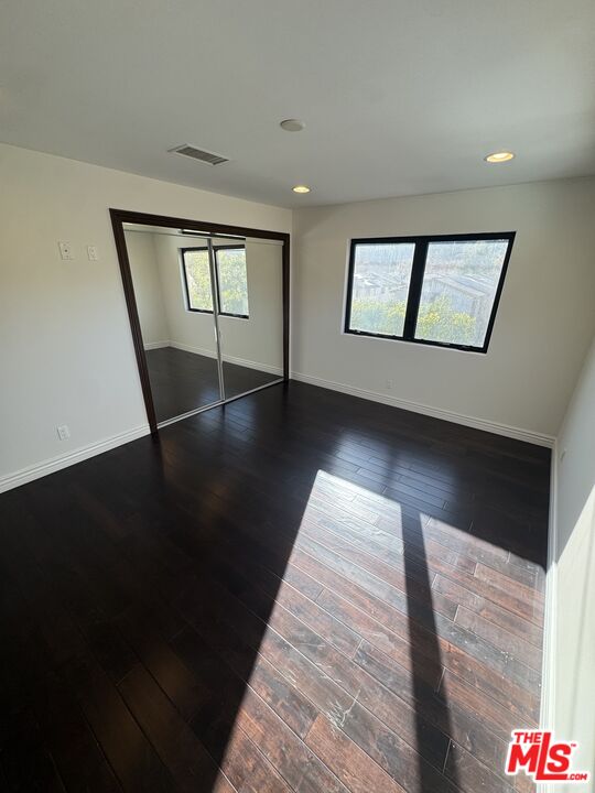 5515 Ruthwood Drive Calabasas, CA 91302 - Photo 35 of 48 a view of an empty room with wooden floor and a window