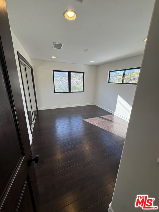 5515 Ruthwood Drive Calabasas, CA 91302 - Photo 37 of 48 wooden floor in an empty room with a window