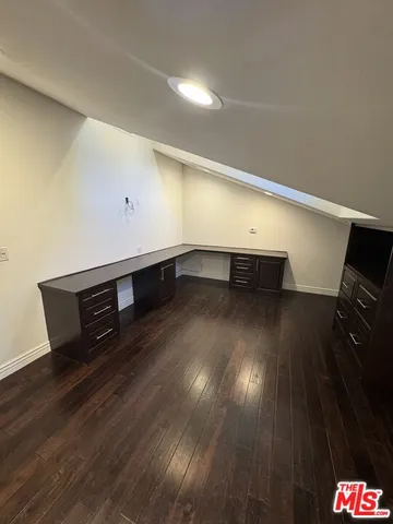 a view of an empty room with stairs