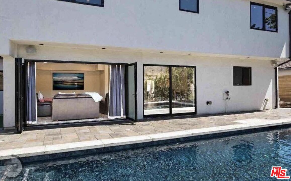 5515 Ruthwood Drive Calabasas, CA 91302 - Photo 4 of 48 a view of an empty room with a fireplace and a window