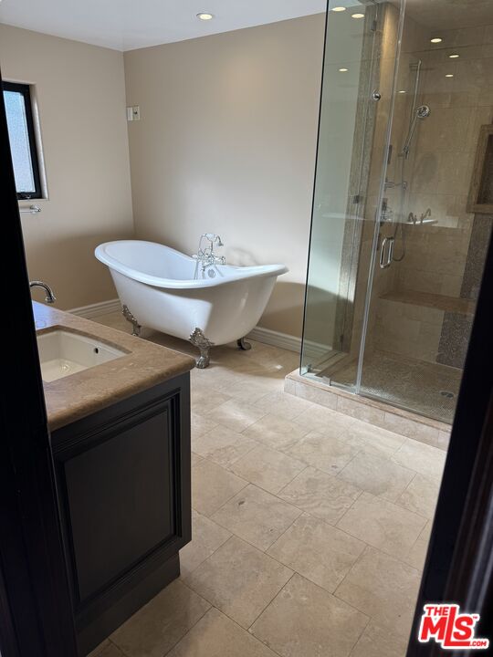 5515 Ruthwood Drive Calabasas, CA 91302 - Photo 48 of 48 a bathroom with a sink and mirror