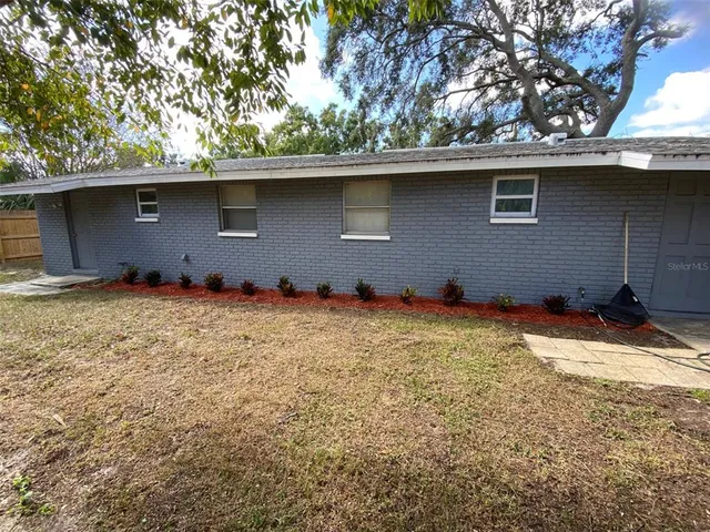 a backyard of a house with lots of green space