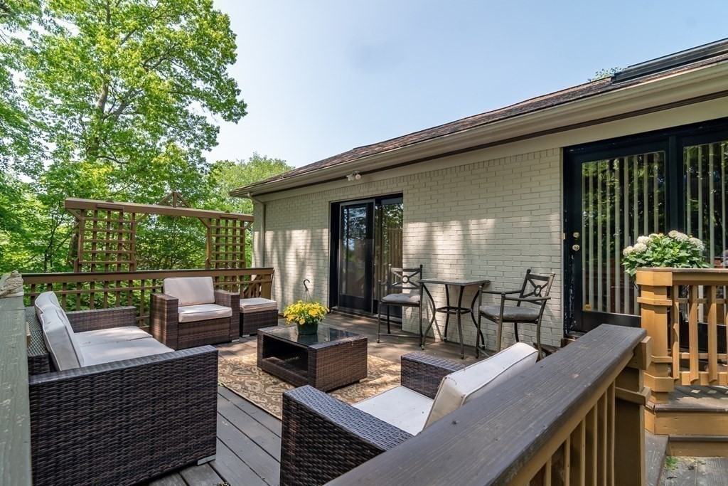 10 Winch Way Natick, MA 01760 - Photo 14 of 34 a view of a patio with couches table and chairs and potted plants