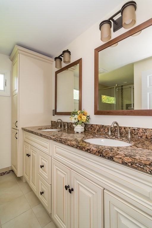 10 Winch Way Natick, MA 01760 - Photo 19 of 34 a bathroom with a sink and a mirror