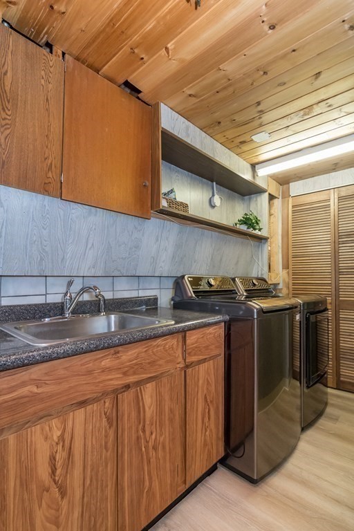 10 Winch Way Natick, MA 01760 - Photo 27 of 34 a kitchen with stainless steel appliances granite countertop a sink and cabinets