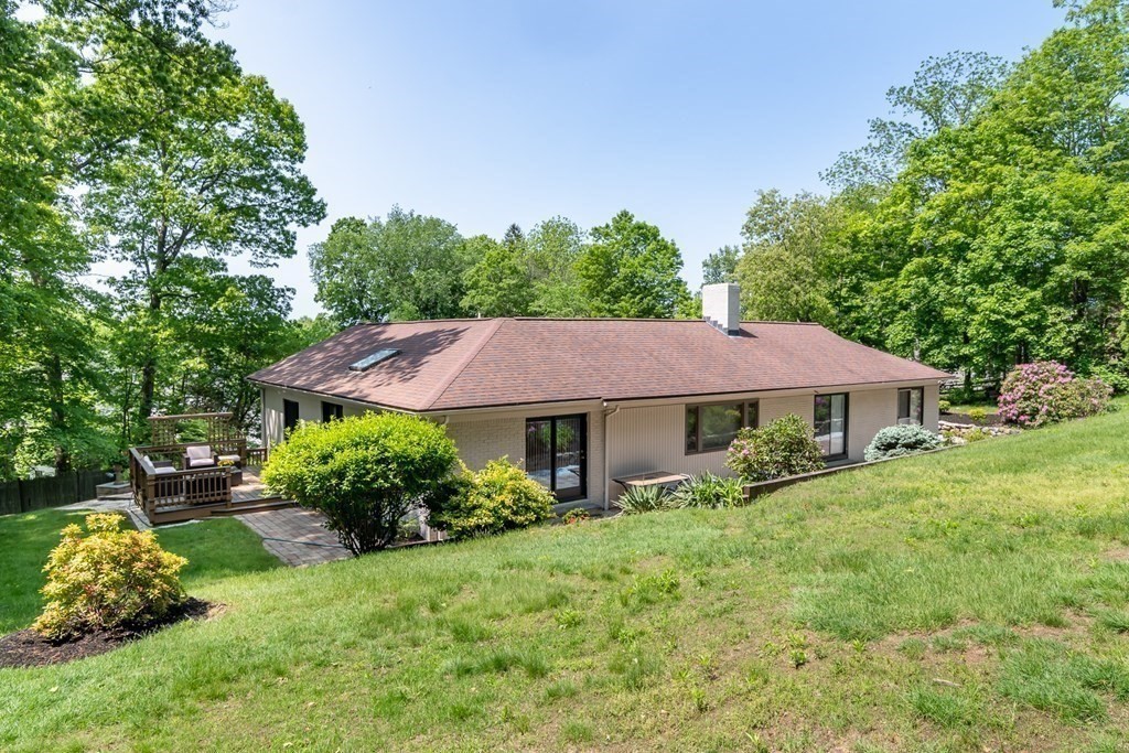 10 Winch Way Natick, MA 01760 - Photo 32 of 34 a front view of a house with garden