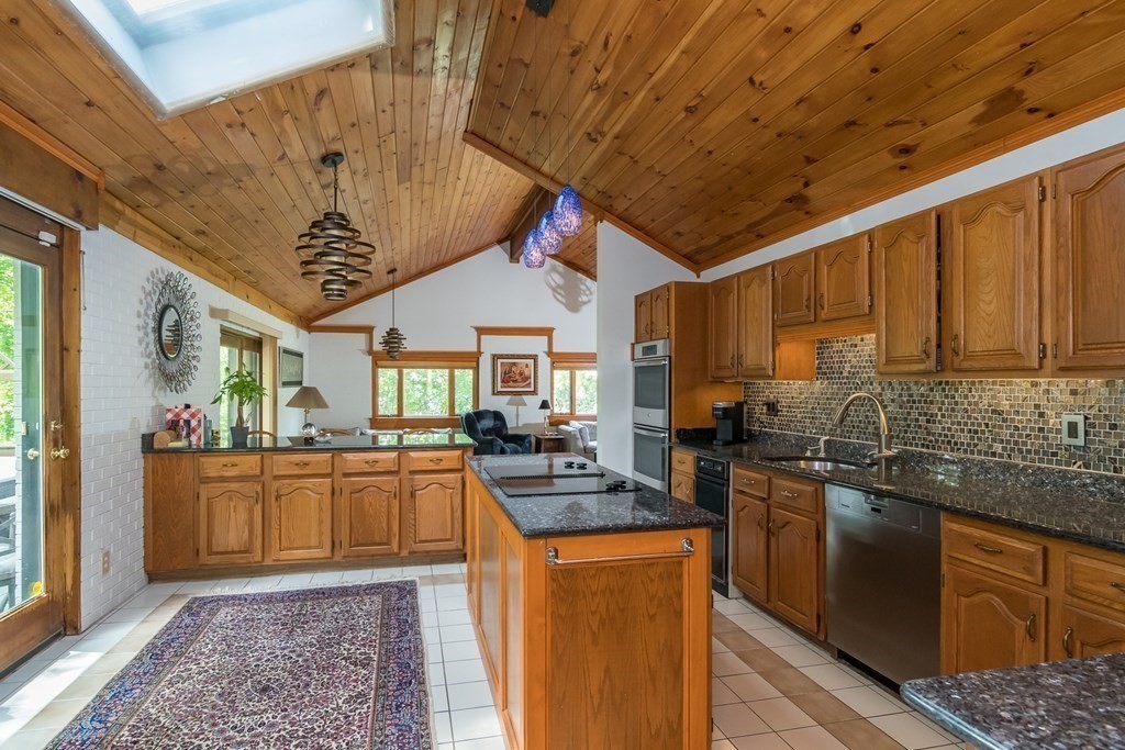 10 Winch Way Natick, MA 01760 - Photo 7 of 34 a kitchen with stainless steel appliances granite countertop a sink stove and cabinets