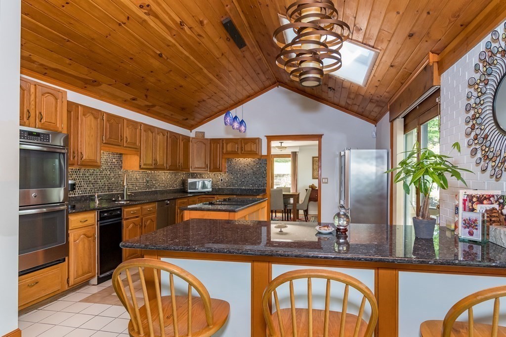 10 Winch Way Natick, MA 01760 - Photo 8 of 34 a kitchen with stainless steel appliances granite countertop a sink and cabinets