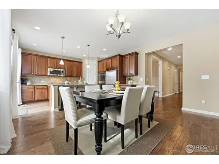 a view of kitchen with dining table and chairs