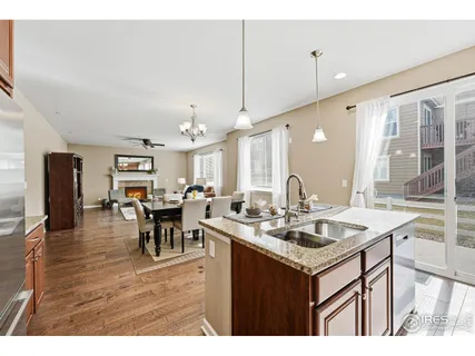 a kitchen with a dining table and chairs