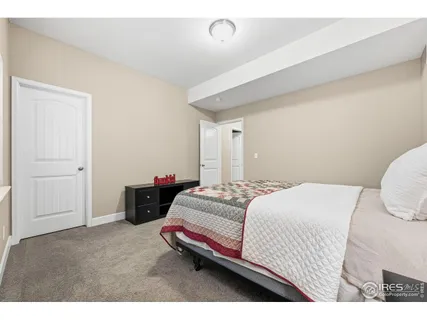 a bedroom with a bed and a cabinets