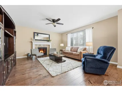 a living room with furniture flat screen tv and a fireplace