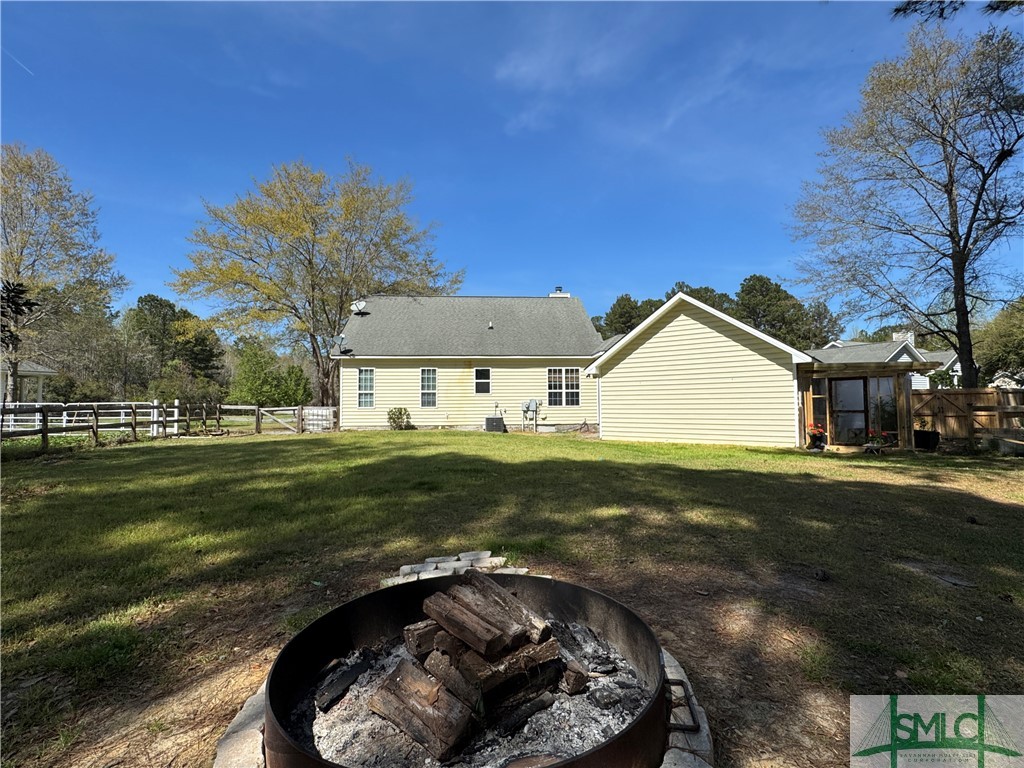 129 Linton Lane Guyton, GA 31312 - Photo 14 of 21 Large Backyard has Fruit Trees lining its edge, fi