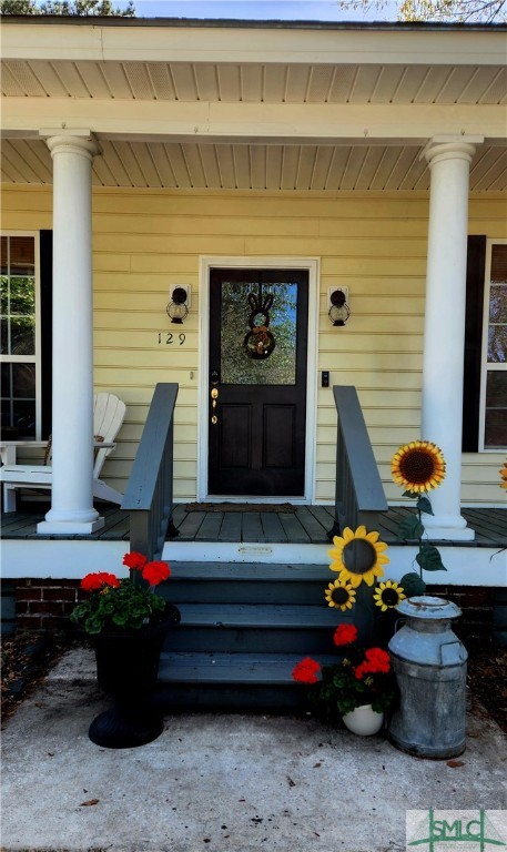 129 Linton Lane Guyton, GA 31312 - Photo 4 of 21 Southern porch is waiting for your Ferns and Rocki