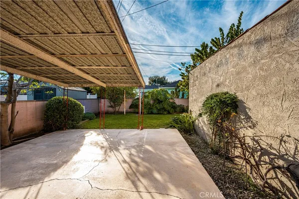 a view of a backyard of the house