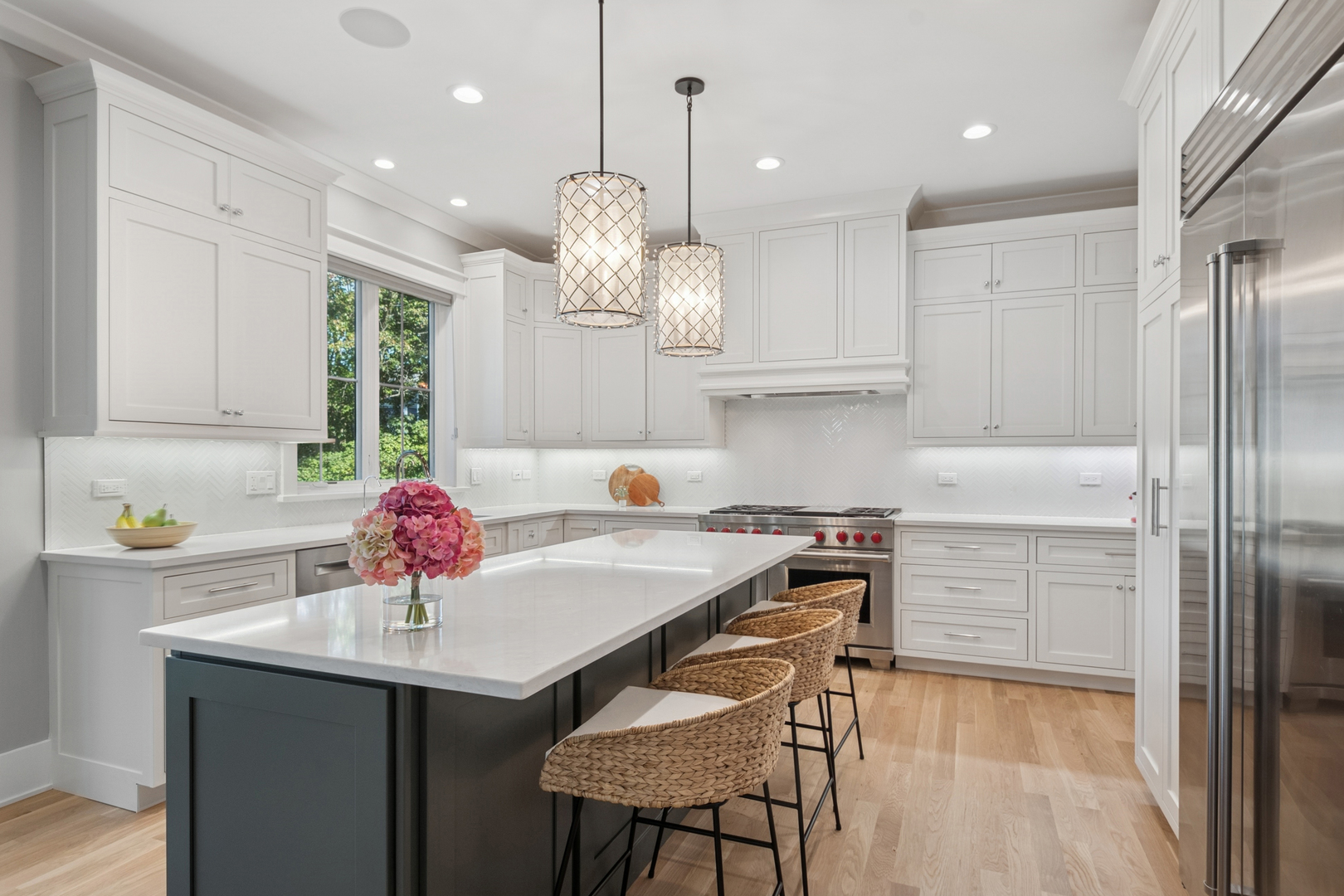 928 Hunter Road Glenview, IL 60025 - Photo 11 of 40 a kitchen with kitchen island a sink counter and chairs