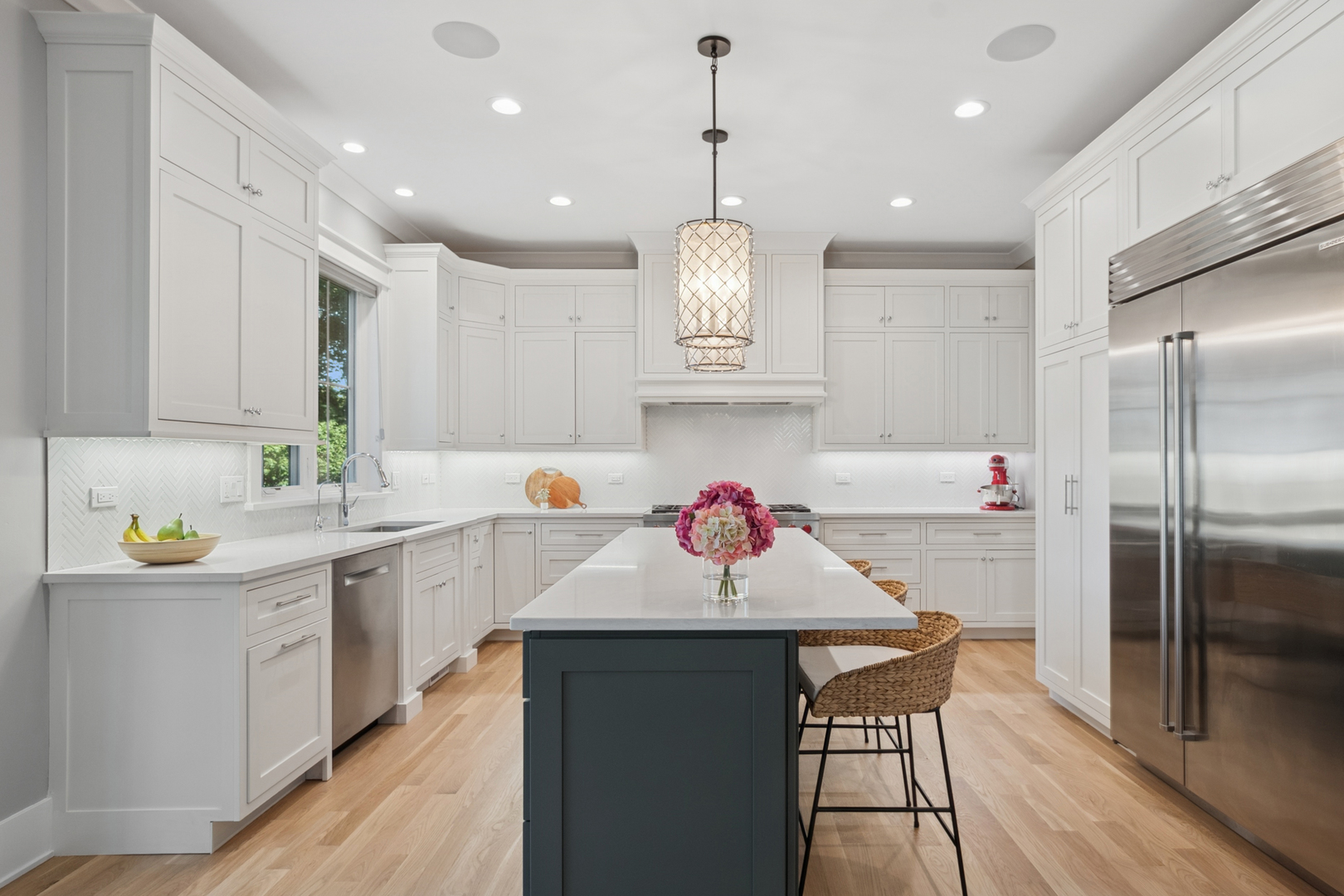 928 Hunter Road Glenview, IL 60025 - Photo 12 of 40 a kitchen with kitchen island a sink stove and refrigerator
