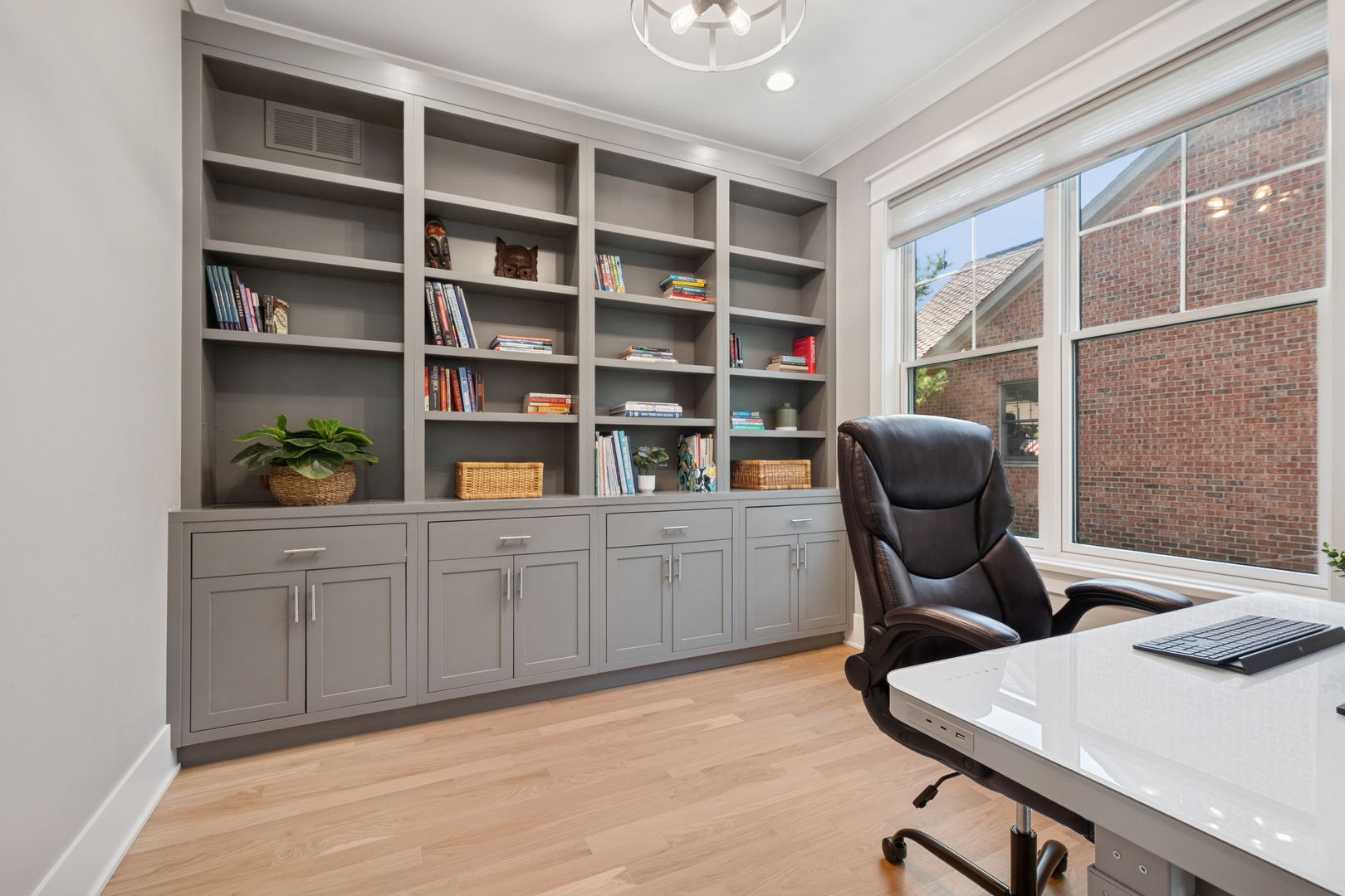 928 Hunter Road Glenview, IL 60025 - Photo 17 of 40 a view of a workspace with furniture and a window