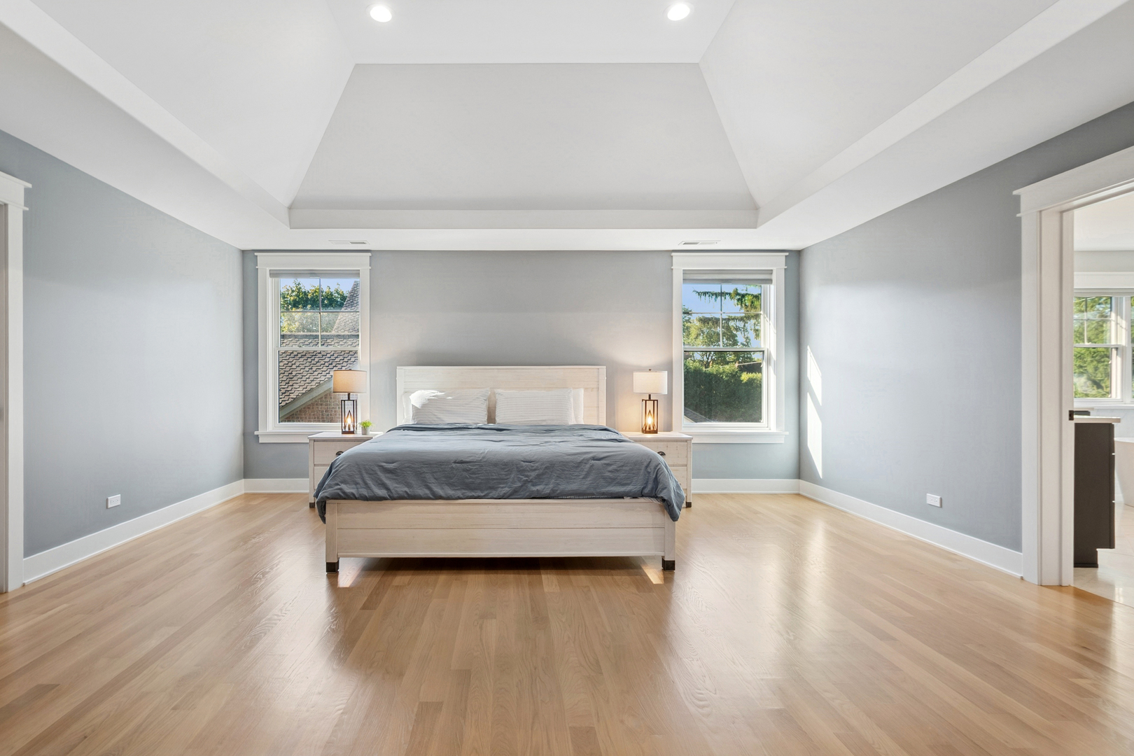 928 Hunter Road Glenview, IL 60025 - Photo 19 of 40 a bedroom with a bed and wooden floor