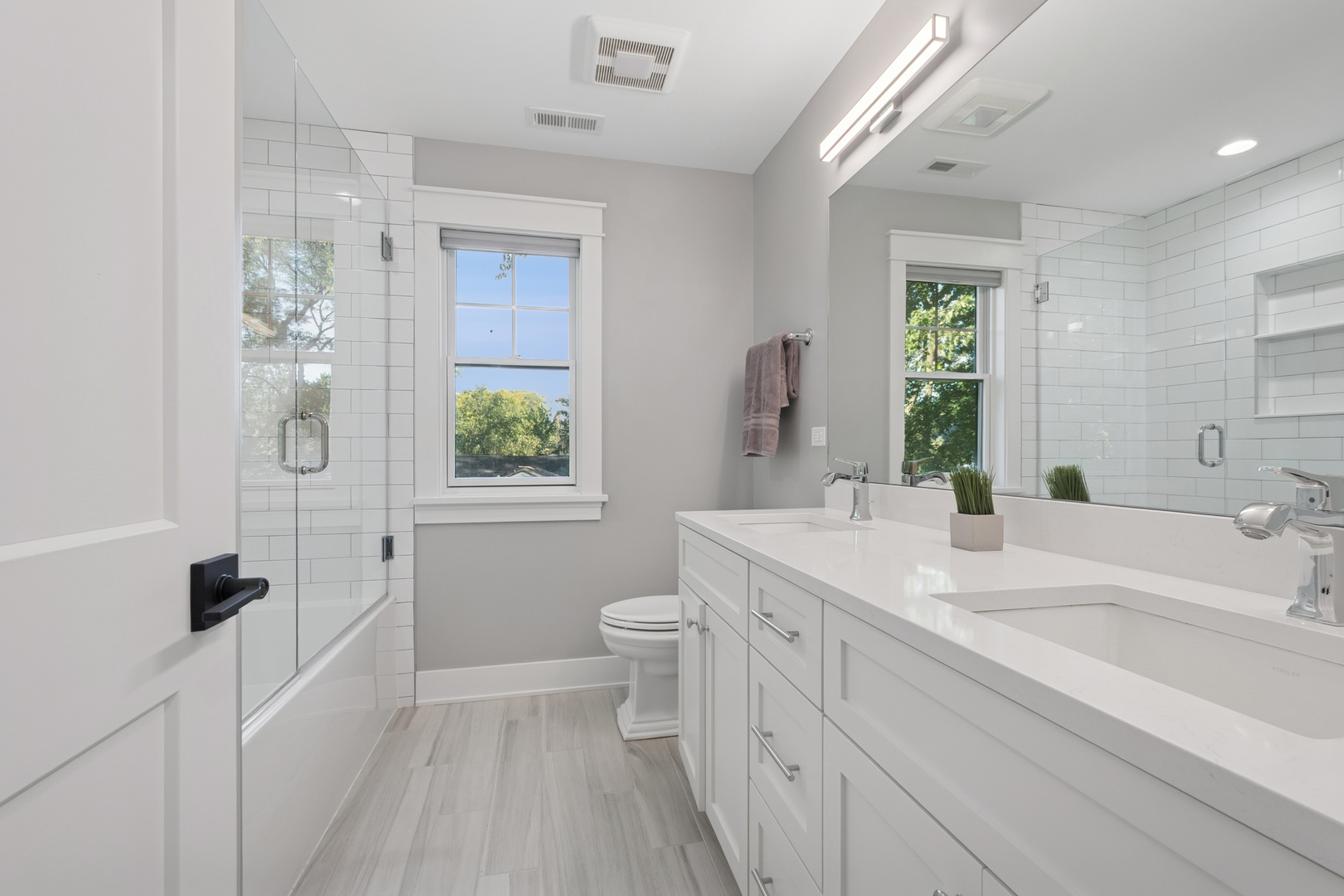 928 Hunter Road Glenview, IL 60025 - Photo 25 of 40 a bathroom with a sink a toilet a window and shower