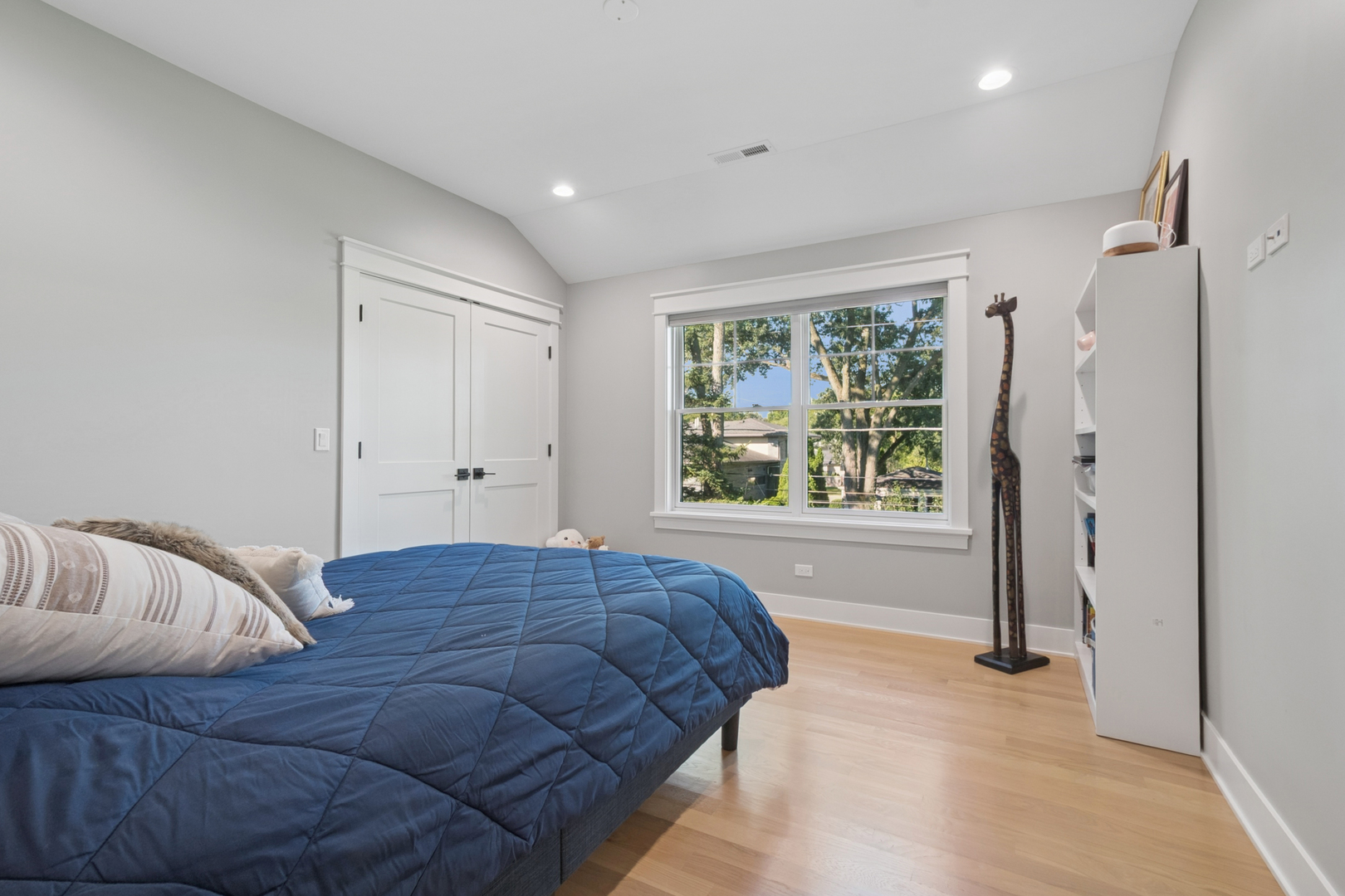 928 Hunter Road Glenview, IL 60025 - Photo 27 of 40 a bedroom with a bed and a window