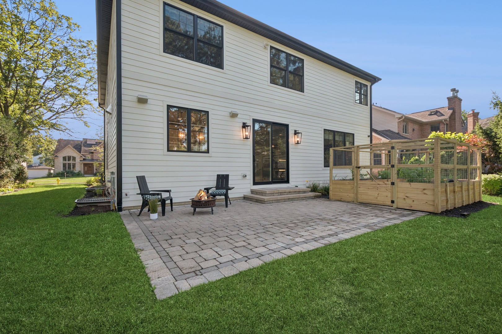928 Hunter Road Glenview, IL 60025 - Photo 36 of 40 a view of a house with a yard and sitting area