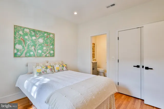 a view of hallway with wooden floor and front door