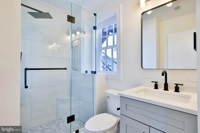 a bathroom with a shower and a toilet