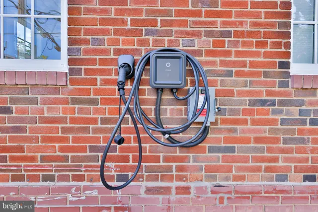 a front view of a house with outdoor seating