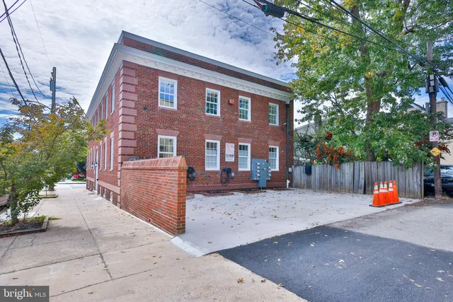 a front view of a building with a couple of windows