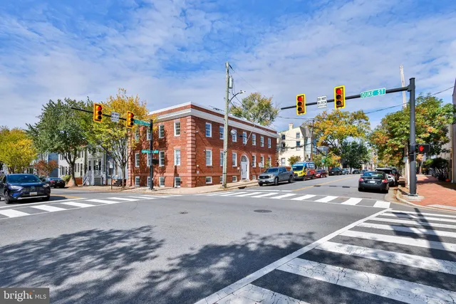 a view of a brick house with a large window