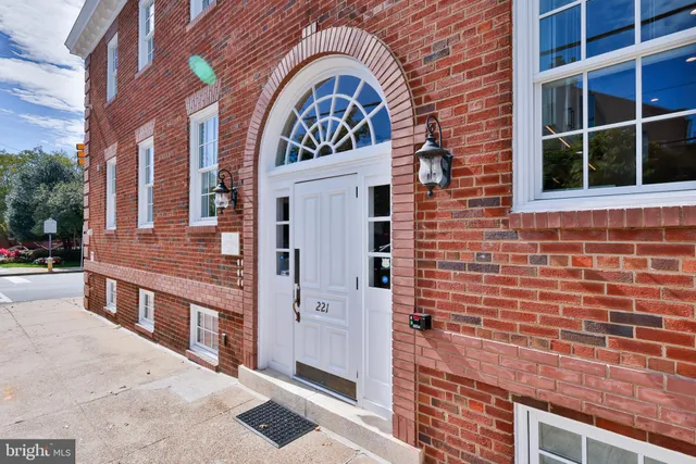 a view of a brick building with many windows