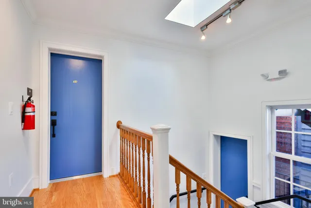 a kitchen with stainless steel appliances a stove a sink a microwave a refrigerator and cabinets