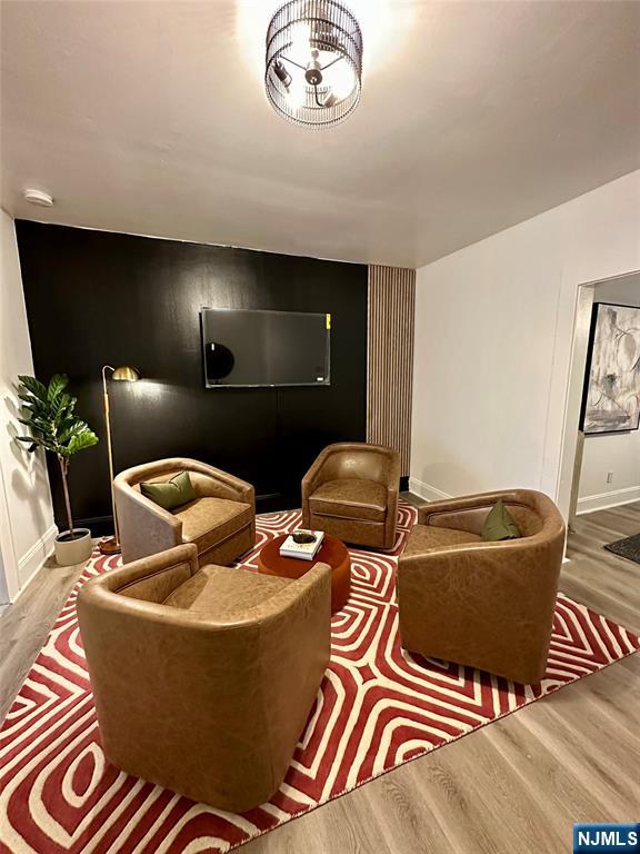 a living room with furniture and a mirror