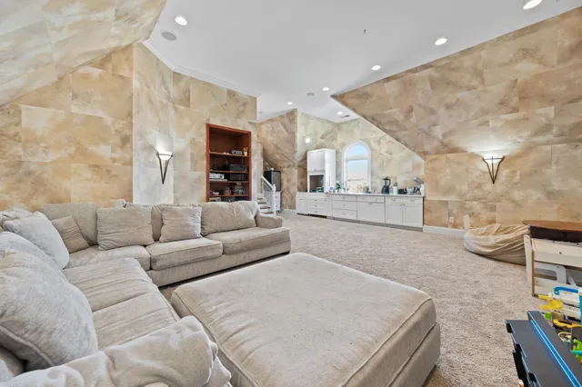 a bathroom with a sink a vanity and a painting on the wall
