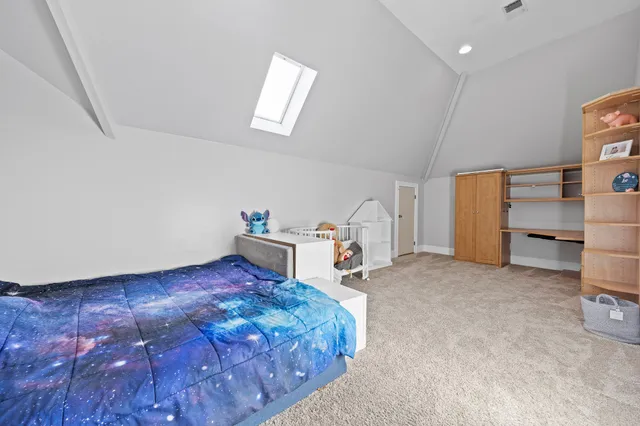 a bathroom with a granite countertop sink mirror and vanity