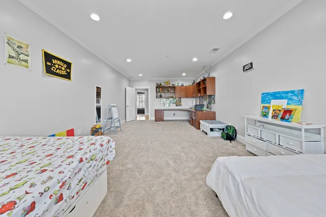 a en suite bathroom with a granite countertop tub and a mirror