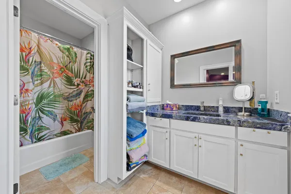 a bedroom with a bed and a cabinets