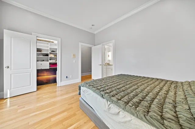 a large kitchen with stainless steel appliances granite countertop a stove and cabinets