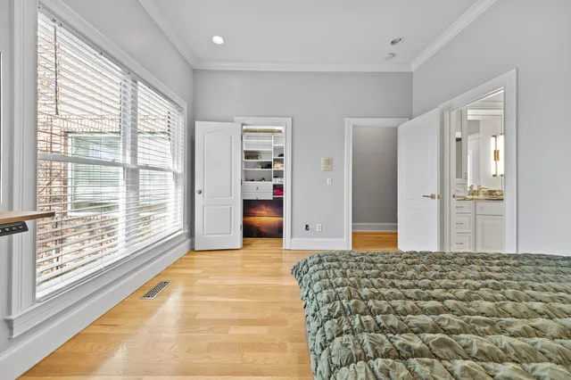 a kitchen that has a sink a stove and a wooden floor